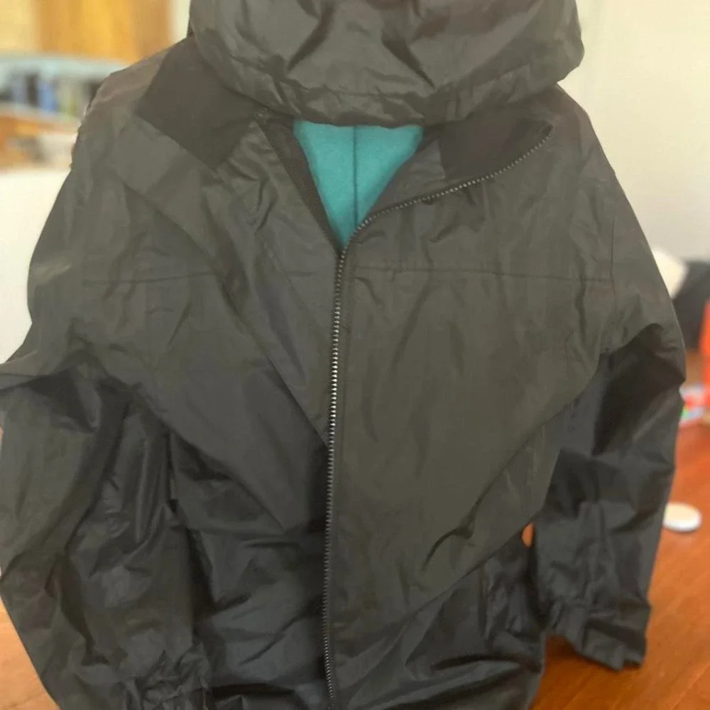 Black and grey waterproof jacket with removable hood